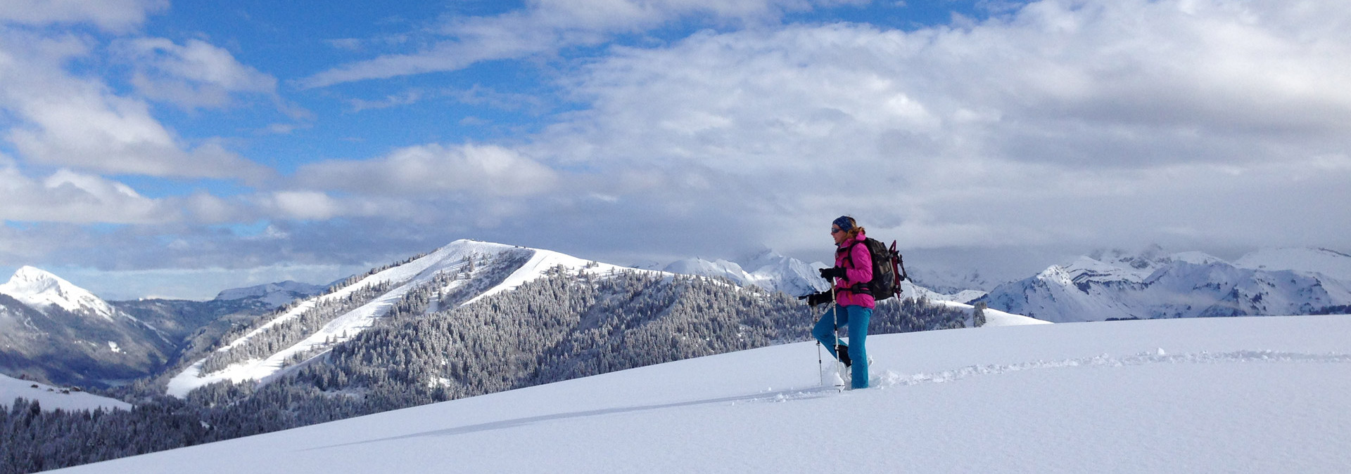 Snowshoe summits in Samoëns - Making fresh tracks in the snow with the Samoëns ski resort in the background.